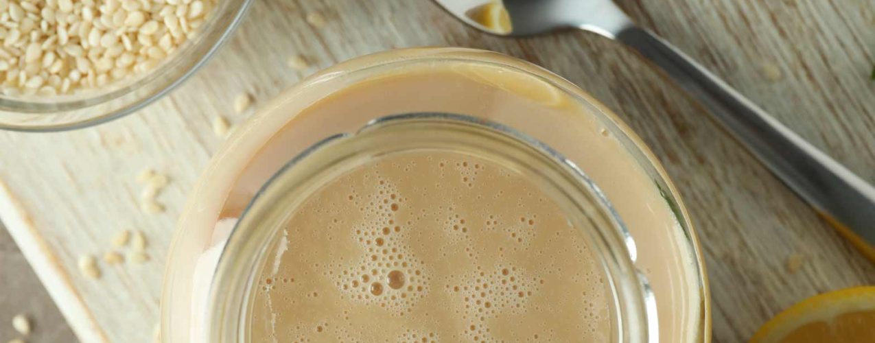 concept-of-tasty-food-with-tahini-sauce-on-beige-t-2023-11-27-05-21-54-utc